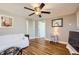 Cozy living room with ceiling fan, hardwood flooring, and two entryways at 4354 Chase St, Denver, CO 80212