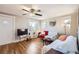 Cozy living room with hardwood floors, ceiling fan, and abundant natural light at 4354 Chase St, Denver, CO 80212