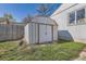 Lawn shed sits on a green lawn with a house and fence in the background at 4354 Chase St, Denver, CO 80212