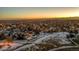 Aerial view of a house in a neighborhood during sunset at 13363 Cherry Ct, Thornton, CO 80241