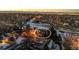 Aerial view of a house in a neighborhood at sunset at 13363 Cherry Ct, Thornton, CO 80241