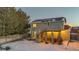 Backyard with deck, hot tub, and snowy landscape at 13363 Cherry Ct, Thornton, CO 80241