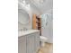 Bathroom with gray vanity, marble countertop, and walk-in shower at 13363 Cherry Ct, Thornton, CO 80241