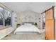 Main bedroom with vaulted ceiling and large window, showcasing mountain wall art at 13363 Cherry Ct, Thornton, CO 80241