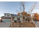 House exterior showcasing a light-blue facade, solar panels, and landscaping at 13363 Cherry Ct, Thornton, CO 80241