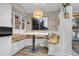 Built-in kitchen nook with seating and a window at 13363 Cherry Ct, Thornton, CO 80241