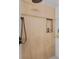 Spa-like shower with wood-look tile and built-in niche at 13363 Cherry Ct, Thornton, CO 80241