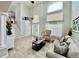 Inviting foyer with high ceilings, chandelier, and neutral decor at 12566 Dexter St, Thornton, CO 80241