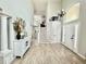 Spacious entryway with staircase, white trim, and high ceilings at 12566 Dexter St, Thornton, CO 80241