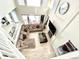 Lofted view of open living space with fireplace and natural light at 12566 Dexter St, Thornton, CO 80241