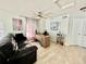 Home office with a ceiling fan, wood floors, and plenty of natural light at 12566 Dexter St, Thornton, CO 80241