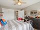 Comfortable bedroom with sporty decor, a ceiling fan, and a closet at 8346 Vivian St, Arvada, CO 80005