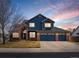 Charming two-story home featuring a three-car garage and a well-maintained front yard at 8346 Vivian St, Arvada, CO 80005