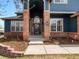 Inviting front entrance with decorative brick pillars and a welcoming doorway at 8346 Vivian St, Arvada, CO 80005