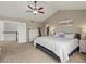 Spacious main bedroom with ceiling fan, ensuite, and walk-in closet at 8346 Vivian St, Arvada, CO 80005