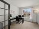 Bright office space featuring a large window and modern workspace at 8346 Vivian St, Arvada, CO 80005
