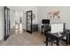 Spacious office, modern desk setup, and stylish glass door entry at 8346 Vivian St, Arvada, CO 80005