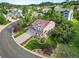 Aerial view of the home and surrounding neighborhood with mature trees and manicured lawns at 2384 Crestridge Dr, Castle Rock, CO 80104