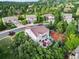 Aerial view of a home nestled among lush trees in a quiet neighborhood, showcasing a private backyard oasis at 2384 Crestridge Dr, Castle Rock, CO 80104