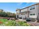 Wonderful backyard featuring a patio, hot tub, grill, lovely flower beds and an outdoor seating area at 2384 Crestridge Dr, Castle Rock, CO 80104