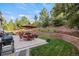 The beautiful outdoor patio area has ample seating and barbecue area, perfect for outdoor dining and entertaining at 2384 Crestridge Dr, Castle Rock, CO 80104