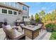 The backyard patio has a fire pit, hot tub and grill; great for entertaining friends and Gathering at 2384 Crestridge Dr, Castle Rock, CO 80104