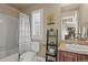 Cozy bathroom featuring shower-tub combination, neutral paint and window shutter at 2384 Crestridge Dr, Castle Rock, CO 80104