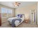 Bedroom featuring a bed with a plush blue blanket, complimented by a large framed mirror at 2384 Crestridge Dr, Castle Rock, CO 80104