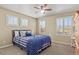 Bright bedroom with neutral walls and ceiling fan, offering a cozy and comfortable space at 2384 Crestridge Dr, Castle Rock, CO 80104