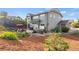 Exterior view showcasing the home's backyard with a patio, hot tub, and manicured landscaping at 2384 Crestridge Dr, Castle Rock, CO 80104
