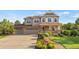 Charming two-story home with a three car garage, covered front porch and landscaped front yard at 2384 Crestridge Dr, Castle Rock, CO 80104
