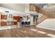 Open floor plan featuring kitchen with stainless appliances and center island at 2384 Crestridge Dr, Castle Rock, CO 80104