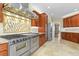Chef's kitchen with stainless steel appliances, a gas cooktop, and custom cabinetry at 2384 Crestridge Dr, Castle Rock, CO 80104
