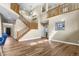 Spacious living room with hardwood floors, staircase, and lots of natural light at 2384 Crestridge Dr, Castle Rock, CO 80104