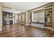 Bright living room features custom built-ins, a window seat and an open floor plan flowing into a dining area at 2384 Crestridge Dr, Castle Rock, CO 80104