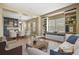 Elegant living room showcasing hardwood floors, built-in shelving, and lots of natural light, great for entertaining at 2384 Crestridge Dr, Castle Rock, CO 80104