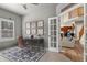Bright home office with a desk and chair, open to living spaces, with a view of kitchen and stairs at 2384 Crestridge Dr, Castle Rock, CO 80104