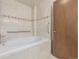 Bathroom featuring a large bathtub and tile flooring at 1673 S Fulton St, Aurora, CO 80247