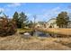 Serene community pond with landscaping at 1673 S Fulton St, Aurora, CO 80247