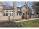 Tan townhome with brick accents and landscaping at 1673 S Fulton St, Aurora, CO 80247