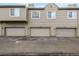 Exterior view of building showcasing three garages at 1673 S Fulton St, Aurora, CO 80247