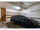 Attached garage with shelving and space for one car at 1673 S Fulton St, Aurora, CO 80247