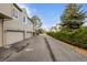 Rear view of attached garages and shared driveway at 1673 S Fulton St, Aurora, CO 80247