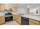 Modern kitchen with stainless steel appliances at 1673 S Fulton St, Aurora, CO 80247