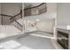 Two-story living room with fireplace and staircase at 1673 S Fulton St, Aurora, CO 80247