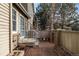 Small brick patio with potted plants and a gate at 1673 S Fulton St, Aurora, CO 80247