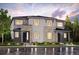 Two-story home with stone and gray siding, a well-manicured lawn, and a welcoming entrance at 14149 Deertrack Ln, Parker, CO 80134