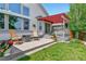 Charming backyard patio featuring rocking chairs and a cozy outdoor space, perfect for enjoying peaceful outdoor moments at 6776 Salvia Ct, Arvada, CO 80007