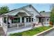 Charming backyard showcasing a spacious deck with outdoor seating and a well-maintained lawn at 6776 Salvia Ct, Arvada, CO 80007