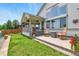 Serene backyard with mature landscaping and a cozy seating area on the patio, perfect for relaxing and outdoor enjoyment at 6776 Salvia Ct, Arvada, CO 80007
